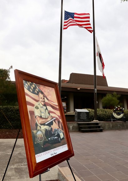 Kings County Deputy Sheriff Allen Sharra's portrait is proudly displayed in the Kings County Government Center Courtyard.